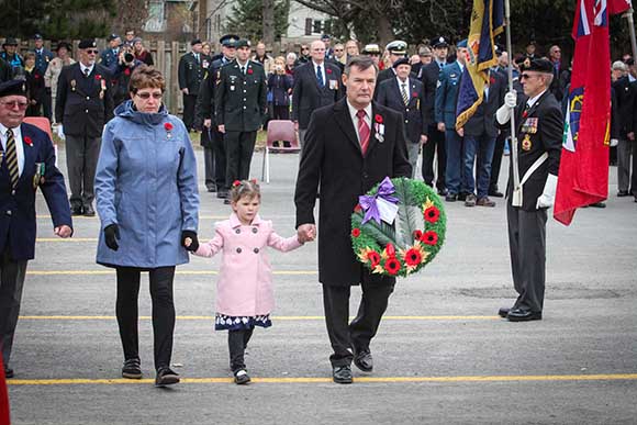 STITTSVILLE, ON. November 11, 2015. Stittsville’s Silver Cross parents Claire and Richard Leger, prepare to lay a wreath with their grand daughter Samantha MacDonald. (Barry Gray/ StittsvilleCentral)