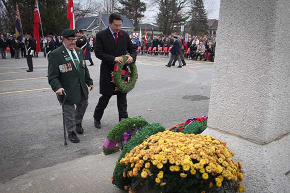 STITTSVILLE, ON. November 11 2015. Stittsville Legion member Johnny Leroux accompanies MP Pierre Polilievre as he lays a wreath at the Cenetoph. (Barry Gray / StittsvilleCentral)