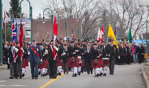 STITTSVILLE, ON. November 11 2015. Colour Party followed by Arnprior Pipe band lead the vetrans from the Legion down Main Street to the Cenetoph. (Barry Gray / StittsvilleCentral)