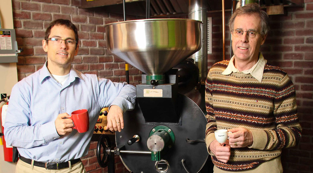 Paul Melsness and Paul Jay in front of the roaster at Gaia Java