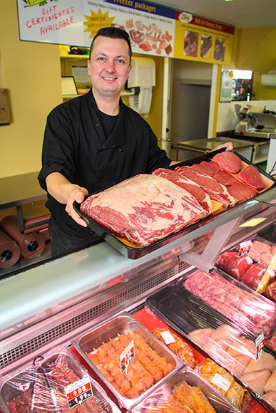 Ivan Saric behind the meat counter. 
