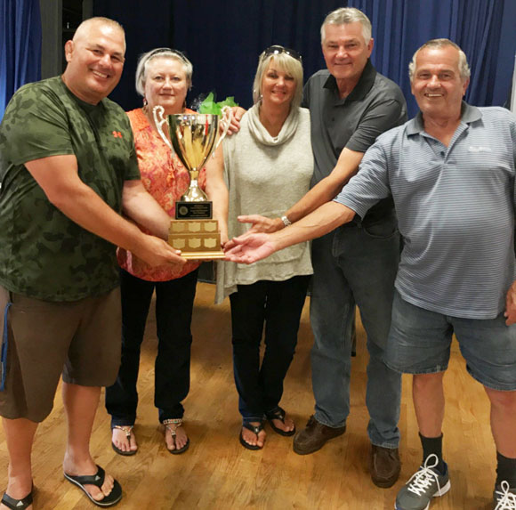 Mike Enid presenting trophy to Diane Doran, Sue Doran, Rick Doran and Brian Doran  - Tournament winners with 9 under par. Stittsville Legion Golf Tournament / August 2017.