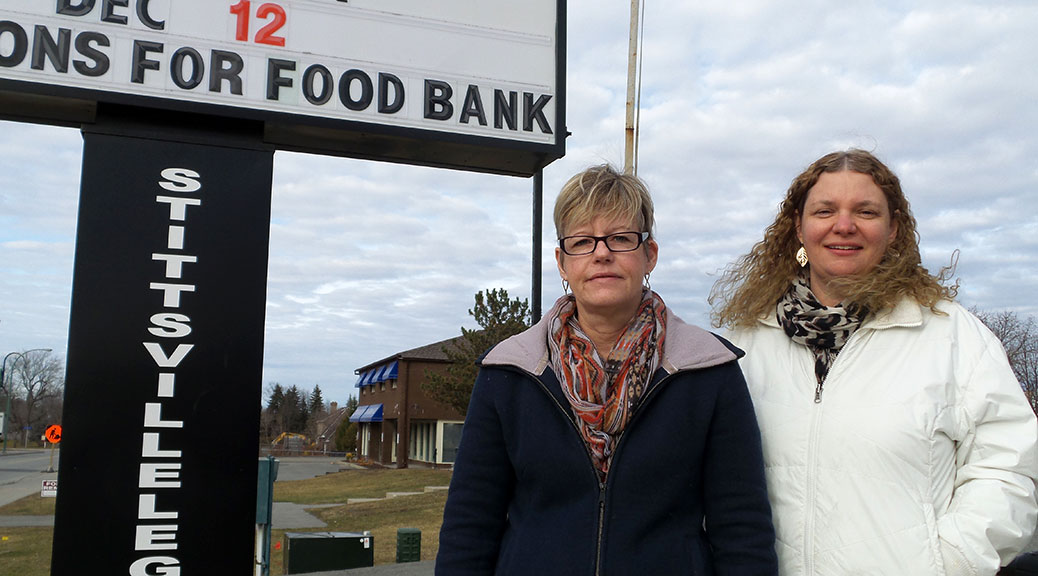 Legion executive members Sue McCormick (left) and Monique Vail in front of the Stittsville Legion sign.