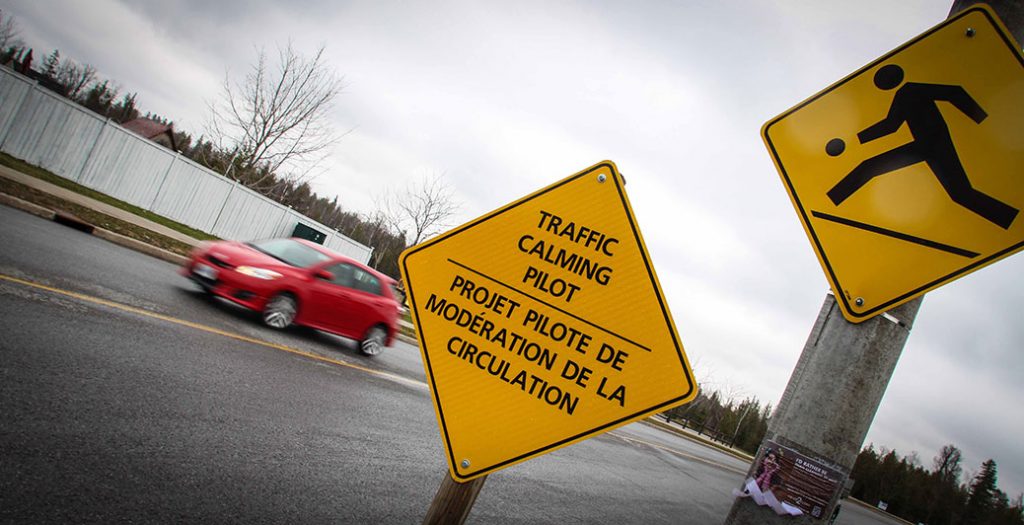 Traffic calming signage along West Ridge. Photo by Barry Gray.